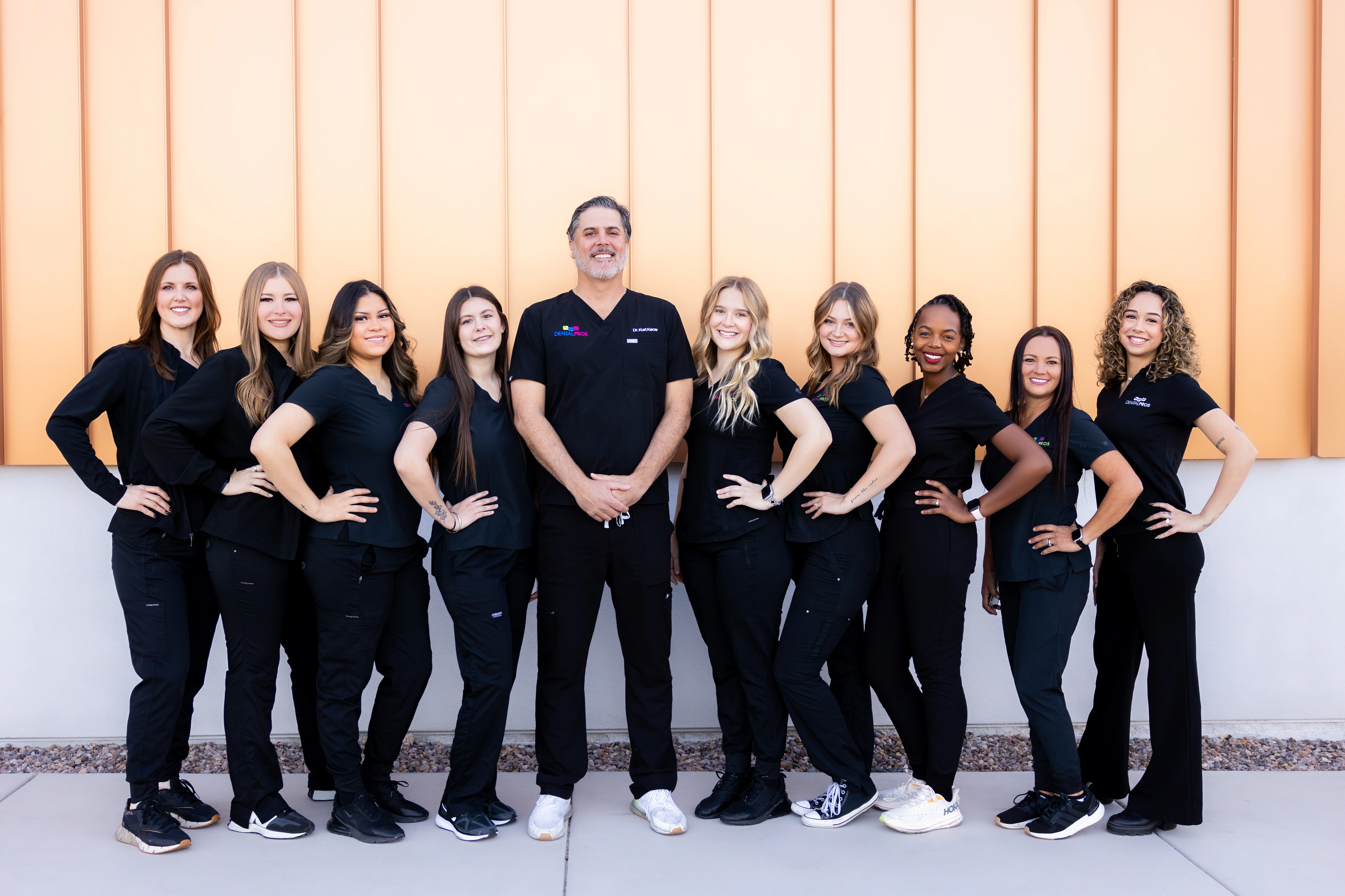 The DentalPros East Tucson team standing together outside the office