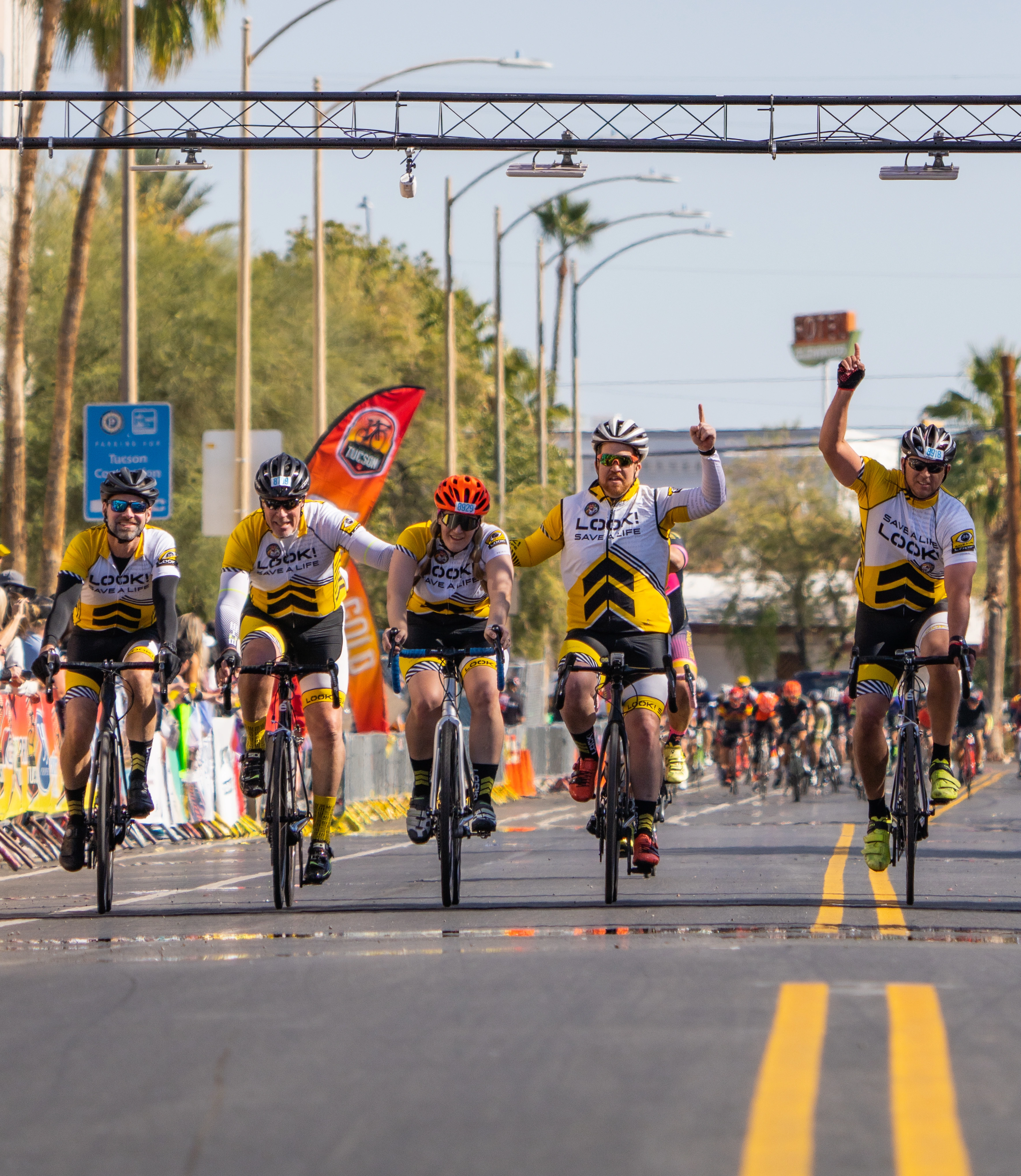 Cyclists crossing the finish line at El Tour de Tucson