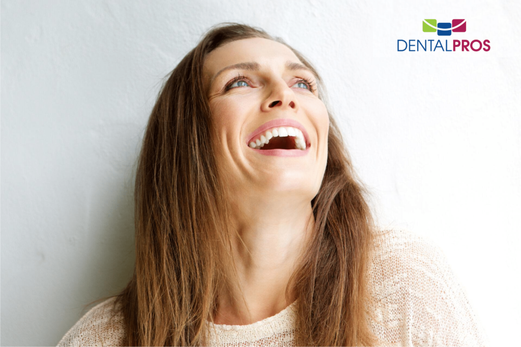 A smiling woman in the original DentalPros oral-surgery artwork
