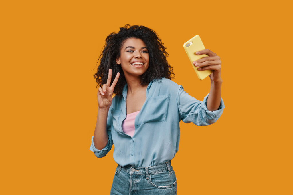 A smiling woman taking a selfie