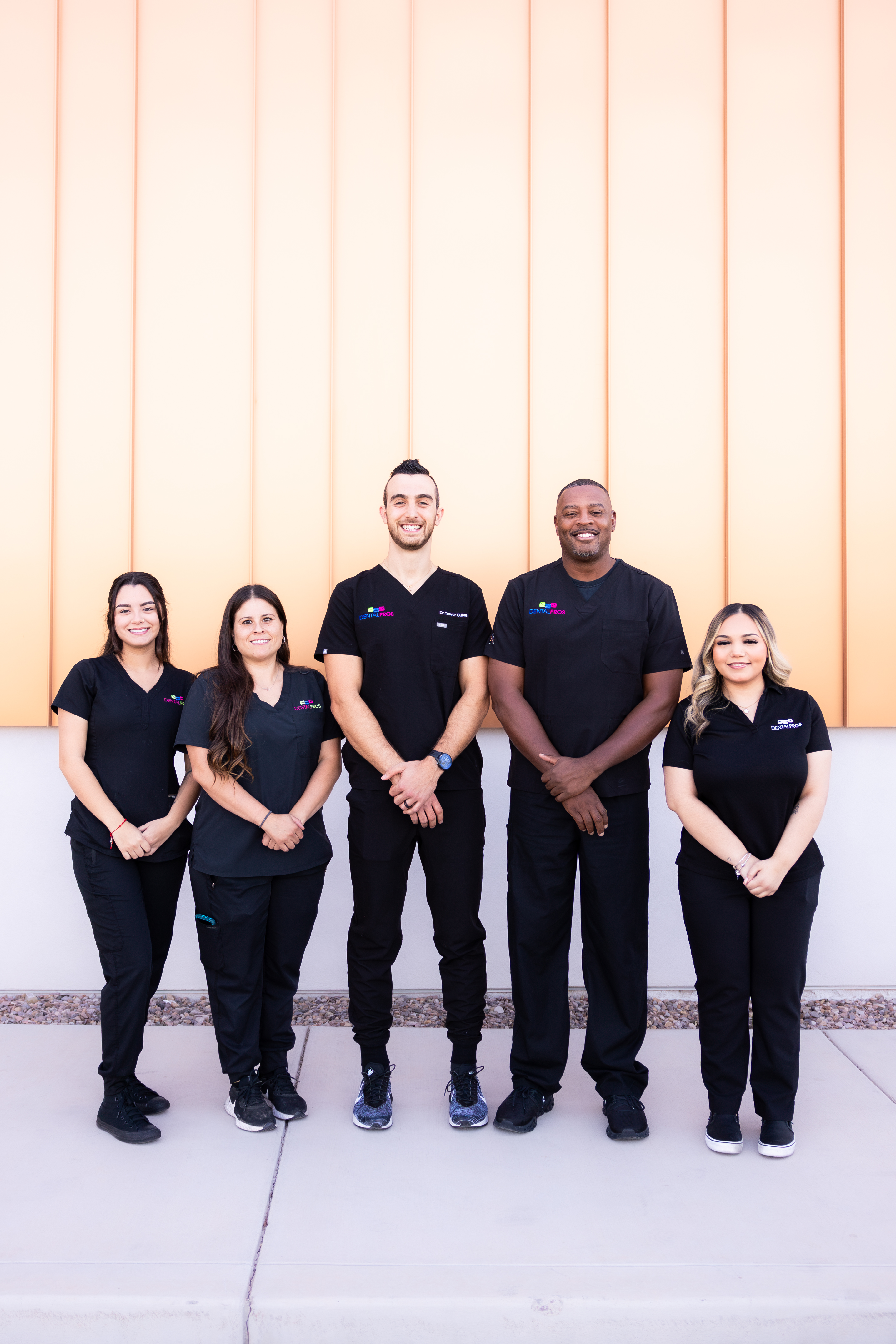 The DentalPros Southwest Tucson team standing together outside the office