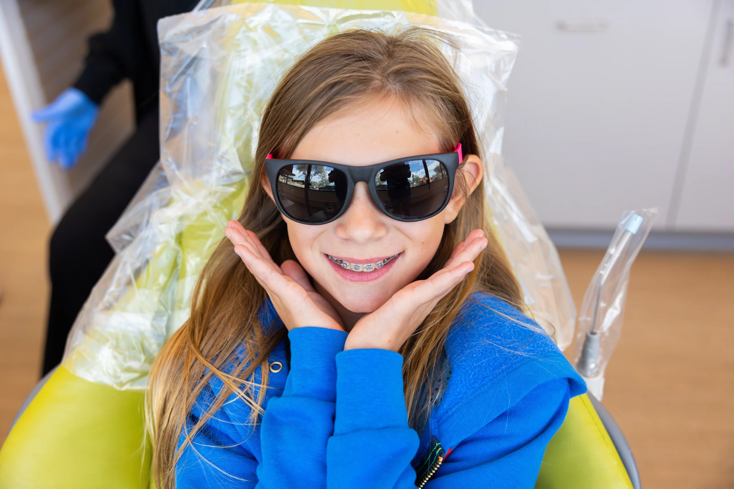 A smiling DentalPros braces patient
