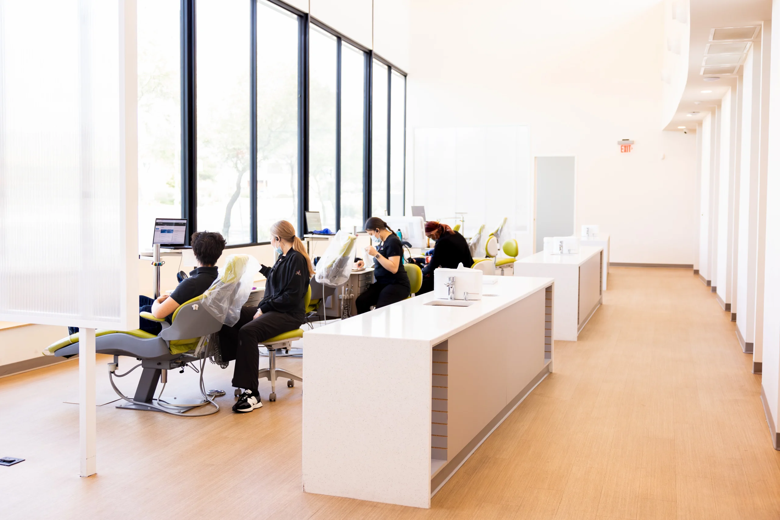 DentalPros hygienists caring for patients in the dental office